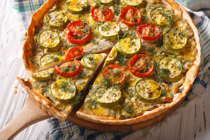Homemade,Sliced,Vegetable,Quiche,With,Cheese,Tomatoes,And,Zucchini,Closeup.
